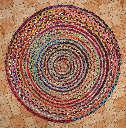 Multicolored braided rug on a wooden floor