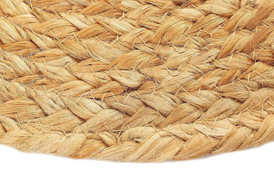 Boho style round jute dining mat adding warmth and texture to modern, coastal, and farmhouse table settings.