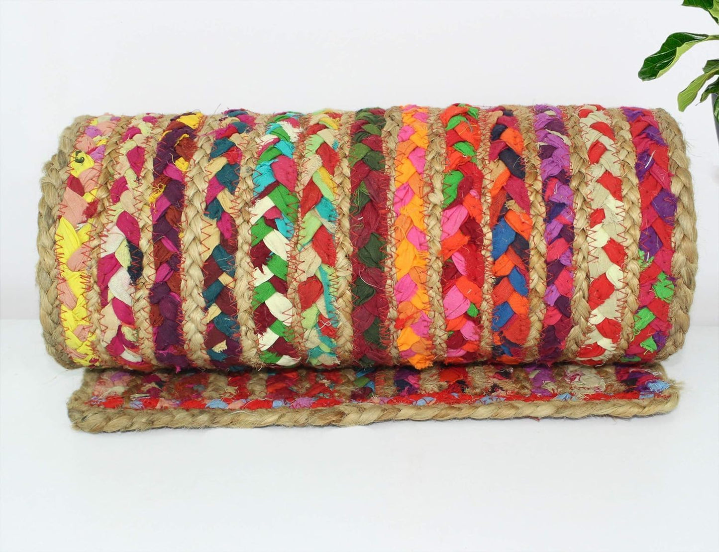 Colorful braided mat on a white background