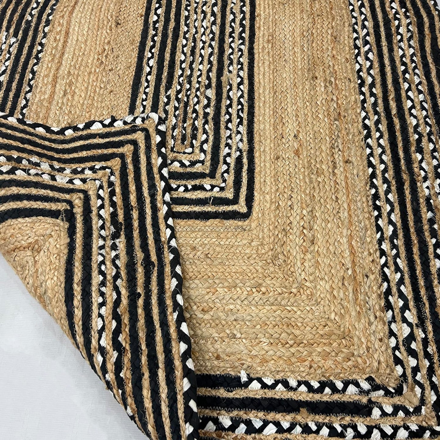 Natural Jute Area Rug with intricate black and white patterns — perfect for adding texture to any living space.