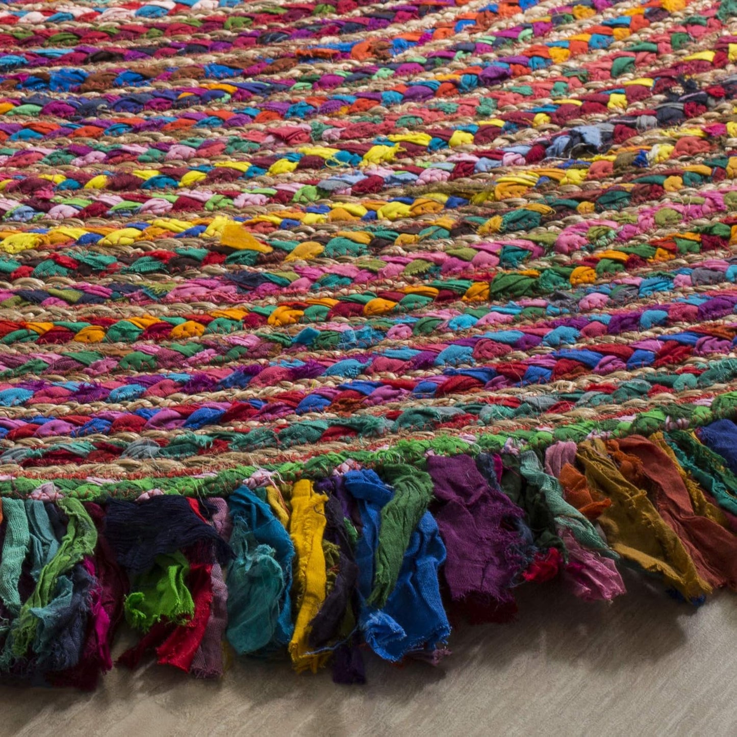Vibrant Natural Jute Area Rug featuring colorful braided textures and fringed edges — perfect for adding warmth to any space.