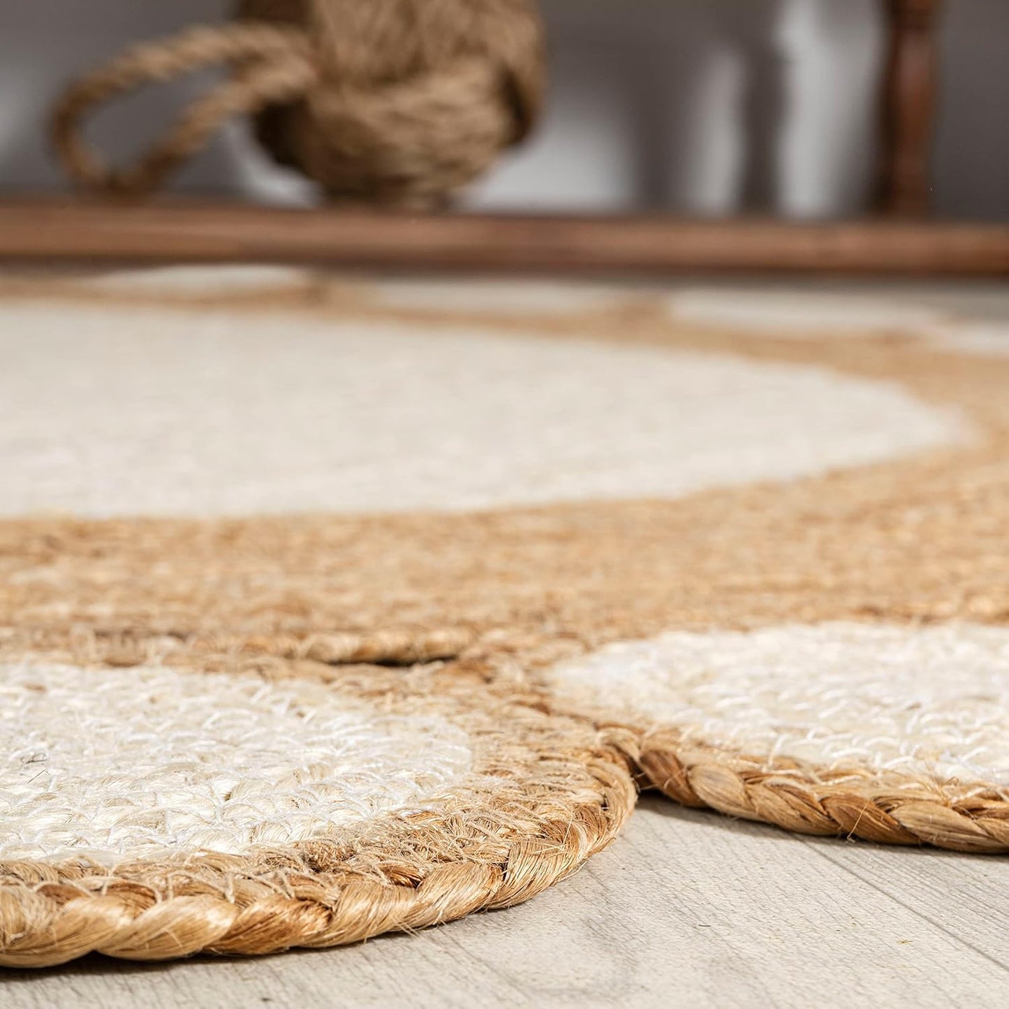 Natural Jute Area Rug with a textured finish, featuring a bohemian design that adds warmth to any living space.