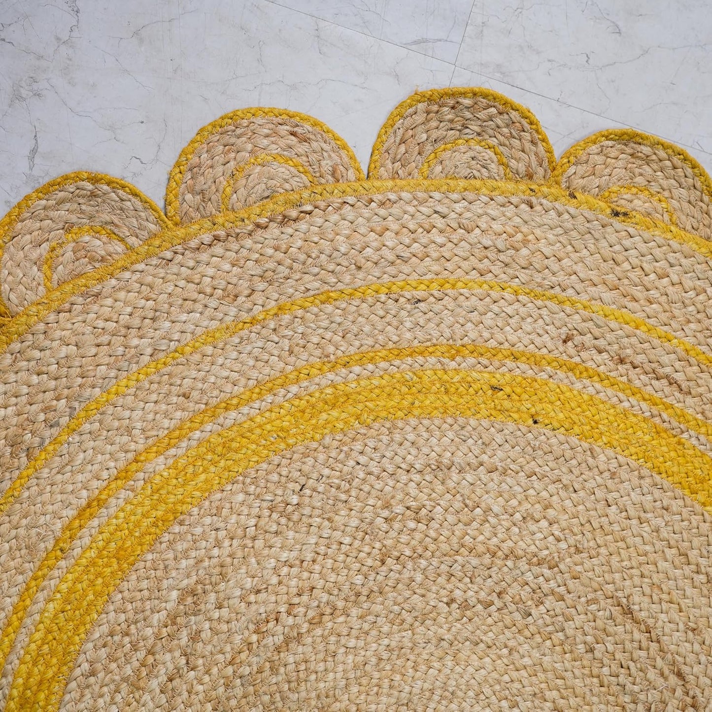 Natural Jute Area Rug with scalloped edges in warm tones β a stylish addition to any entryway or living space.