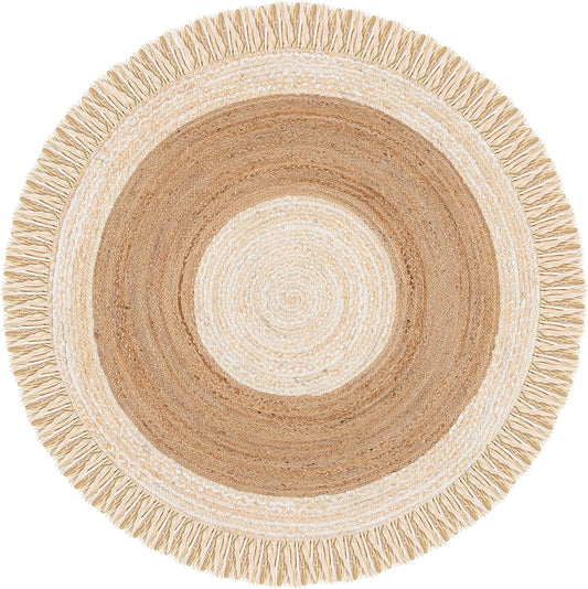 A round braided rug with concentric rings in cream, tan, and light brown, finished with fringe trim around the edge, shown on a plain white background.