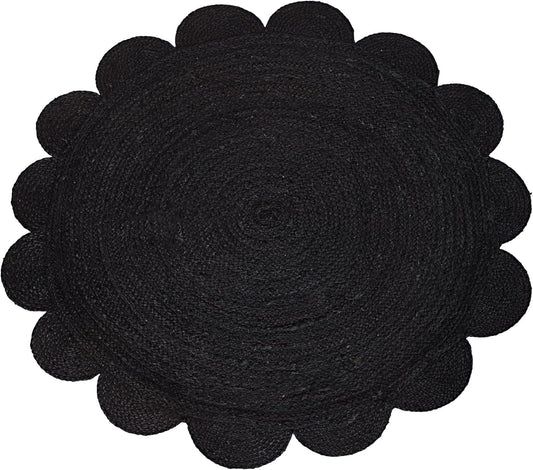 Black woven mat with scalloped edge on a white background