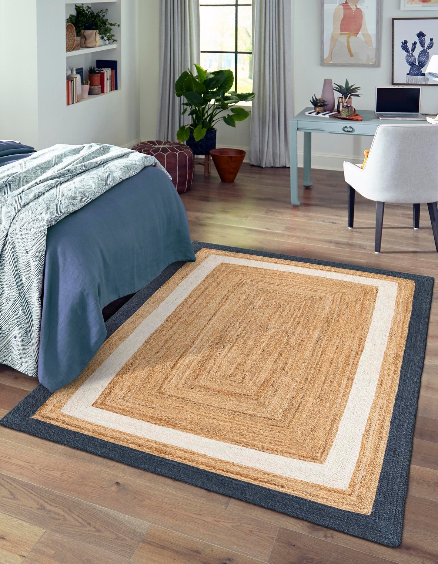 Natural jute area rug, beige and cream color with dark border, perfect for bedroom decor.