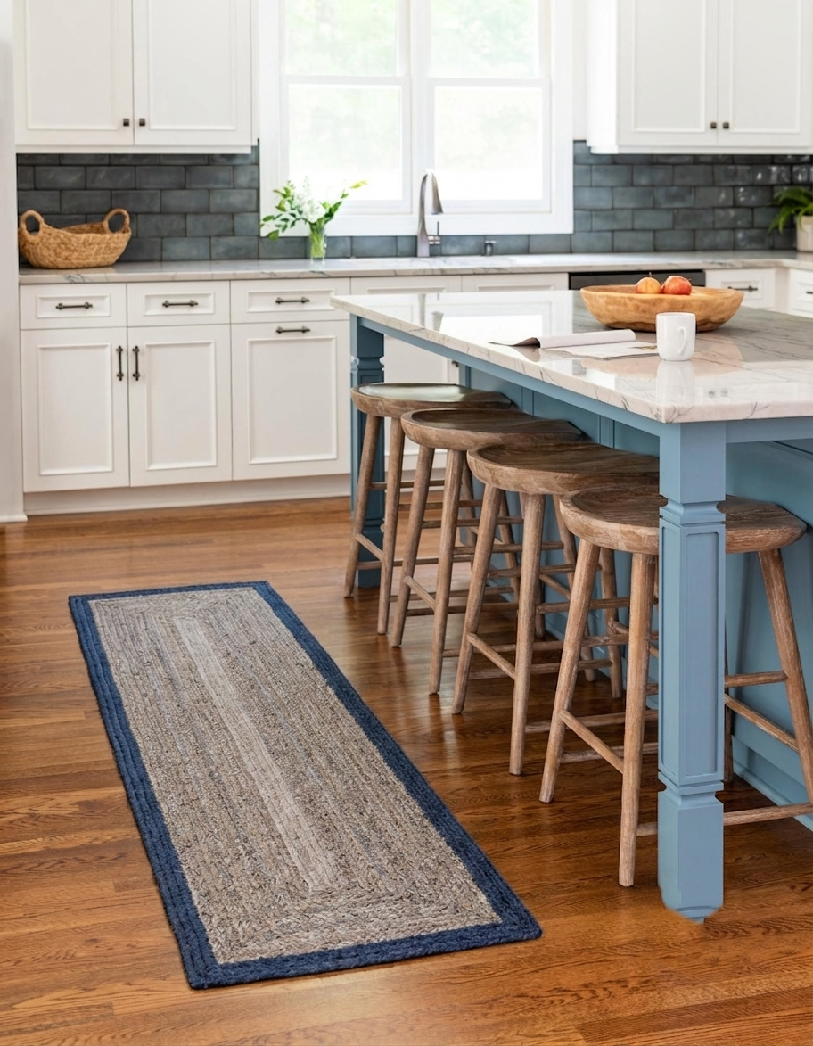 Natural Jute Area Rug floor carpet with blue border, handmade Jute Runner style, in a bright kitchen entryway setting