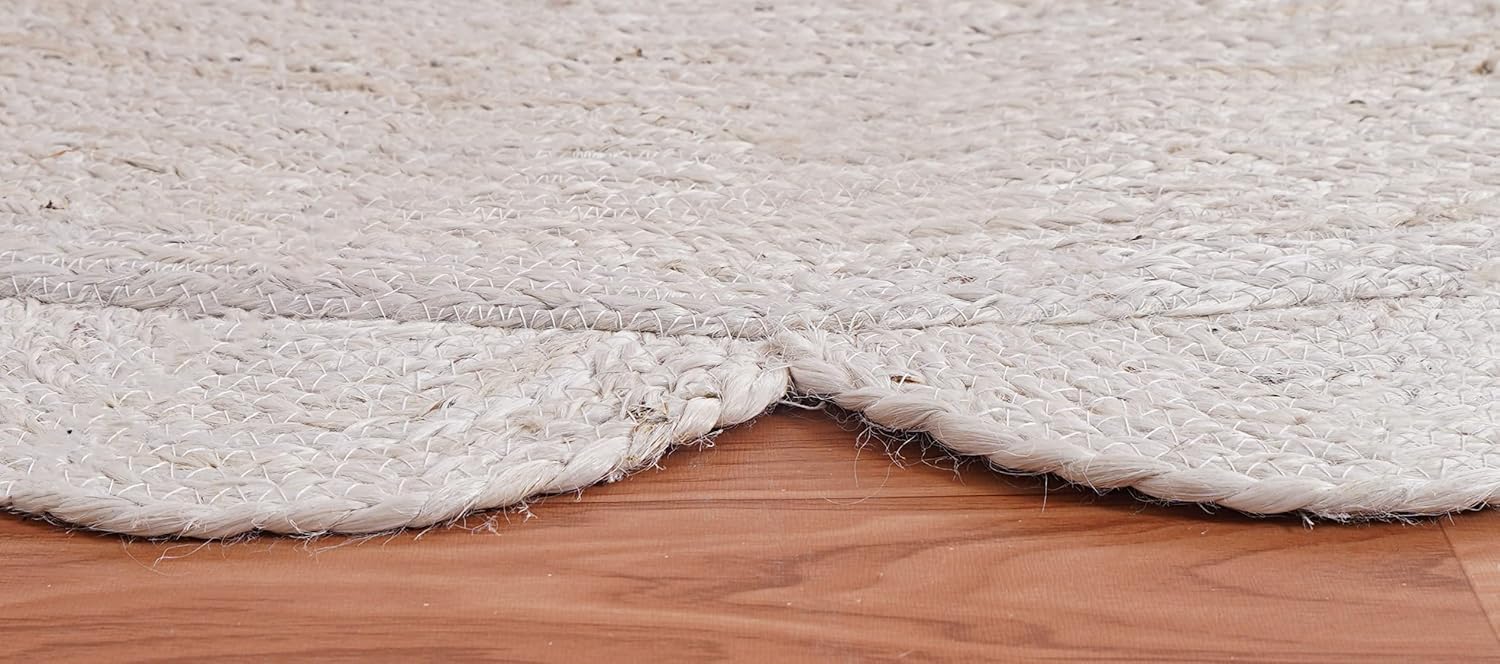 Close-up of a white rug on a wooden floor