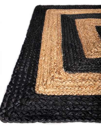 Black Jute Rug with natural jute panels and hand-braided construction, indoor hallway and entryway area rug style close-up