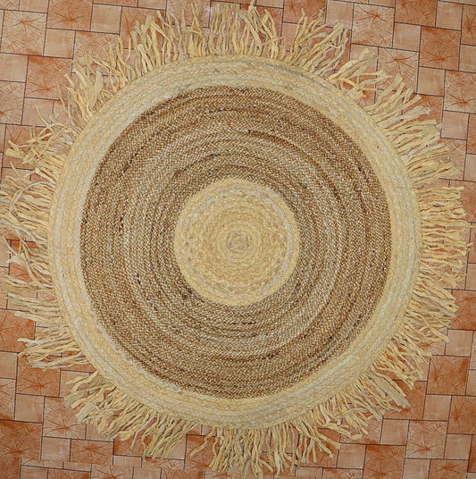 Round woven rug with fringes on a tiled floor