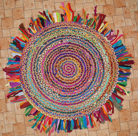 Colorful braided rug with tassels on a wooden floor