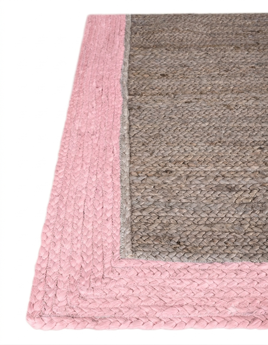 Natural Jute Area Rug with pink and gray braided border, hand-braided construction and textured weave corner detail