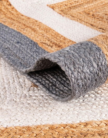 Natural Jute Area Rug Floor Carpet woven natural jute with grey trim on a flat surface