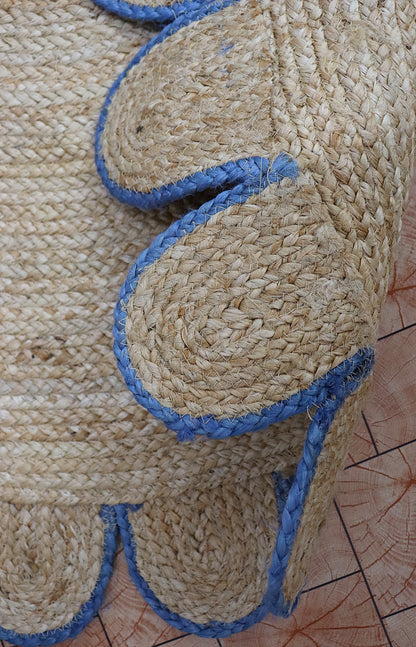Close-up of a woven mat with blue accents on a wooden surface