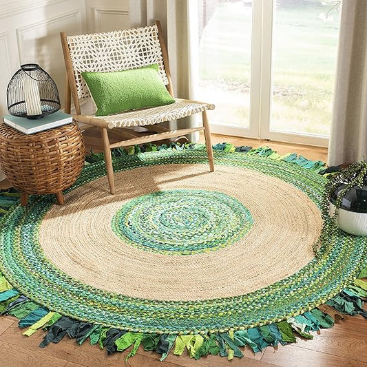 Round green and beige braided rug with a chair and small table in a room.