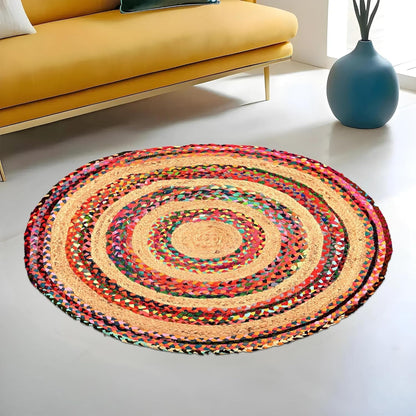 Vibrant Natural Jute Area Rug in a circular design, featuring colorful braided patterns, perfect for enhancing any living space.