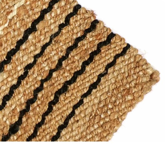 Natural jute area rug with black striped design, eco-friendly and durable for home decor.