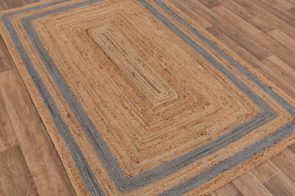 Braided jute area rug with blue stripes, rectangular shape, earthy tones, perfect for cozy home decor.