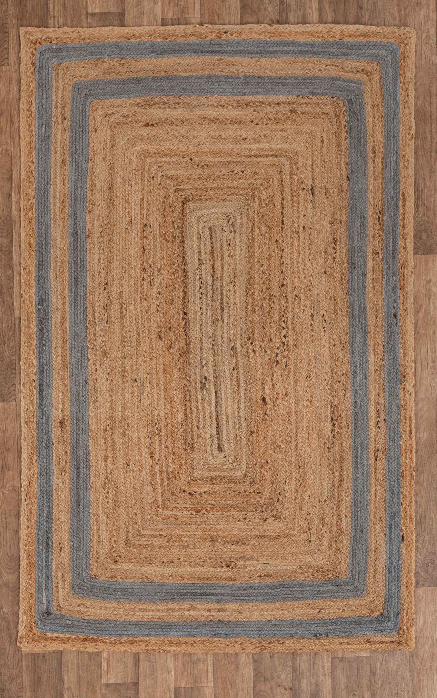 Natural jute area rug with blue stripes, rectangular shape, perfect for adding warmth to any room.
