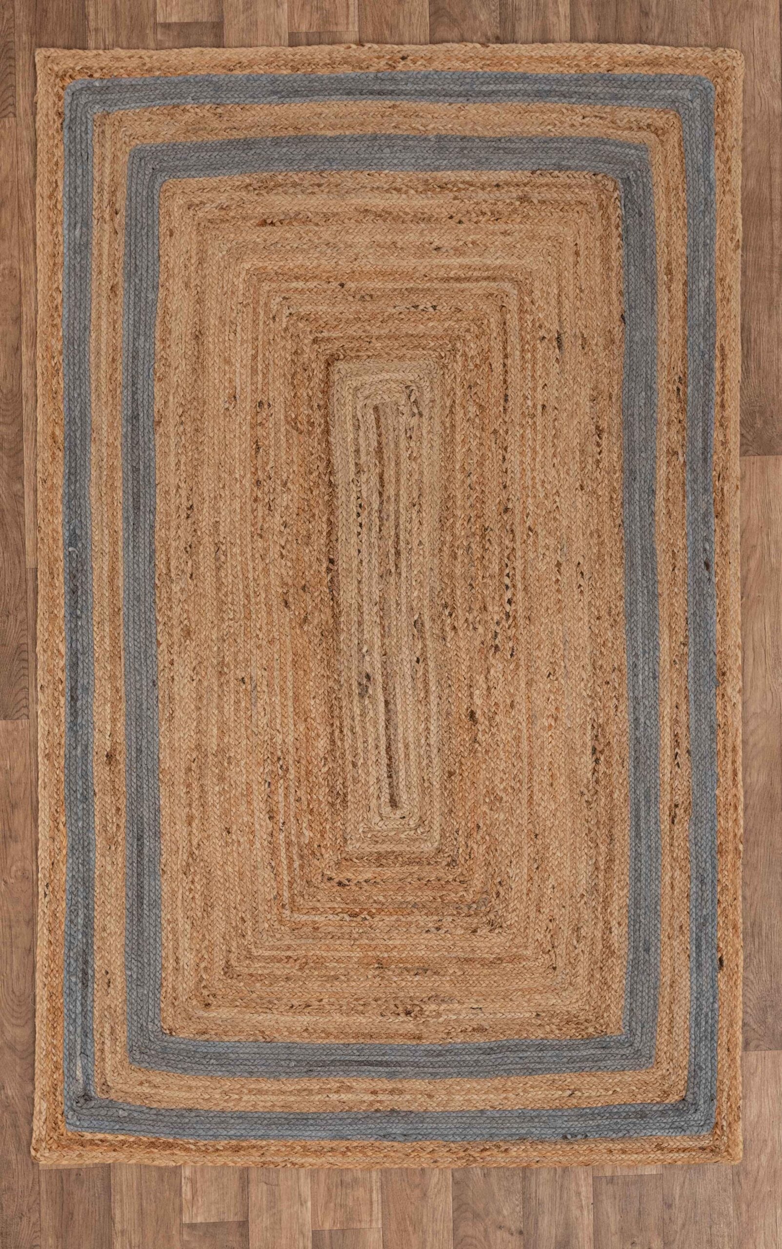 Natural jute area rug with blue stripes, rectangular shape, perfect for adding warmth to any room.