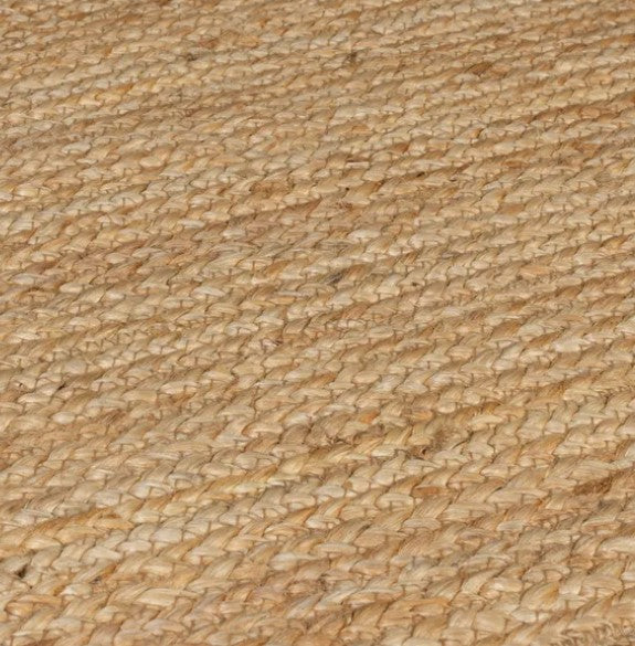 Natural jute area rug, woven design in beige, perfect for eco-friendly home decor.