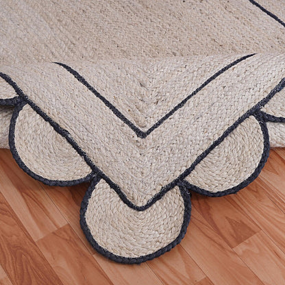 Natural Jute Area Rug with scalloped edges and navy trim — a versatile floor carpet perfect for any room.