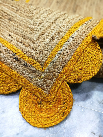 Natural Jute Area Rug with a scalloped edge in warm tones, adding a cozy touch to any living space.