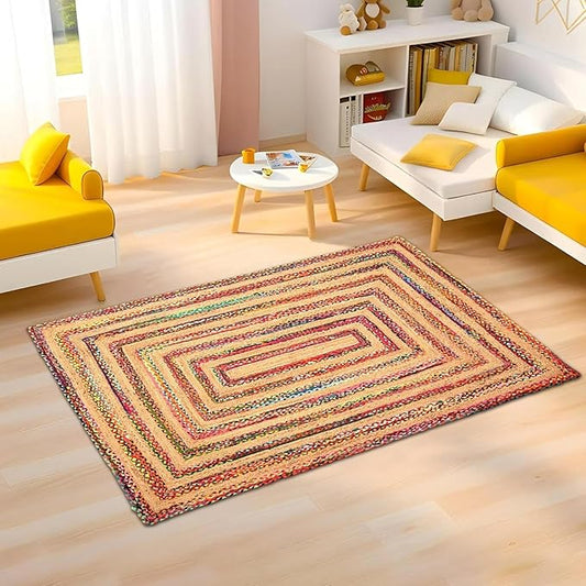 Multicolored braided rug on a wooden floor in a living room setting.
