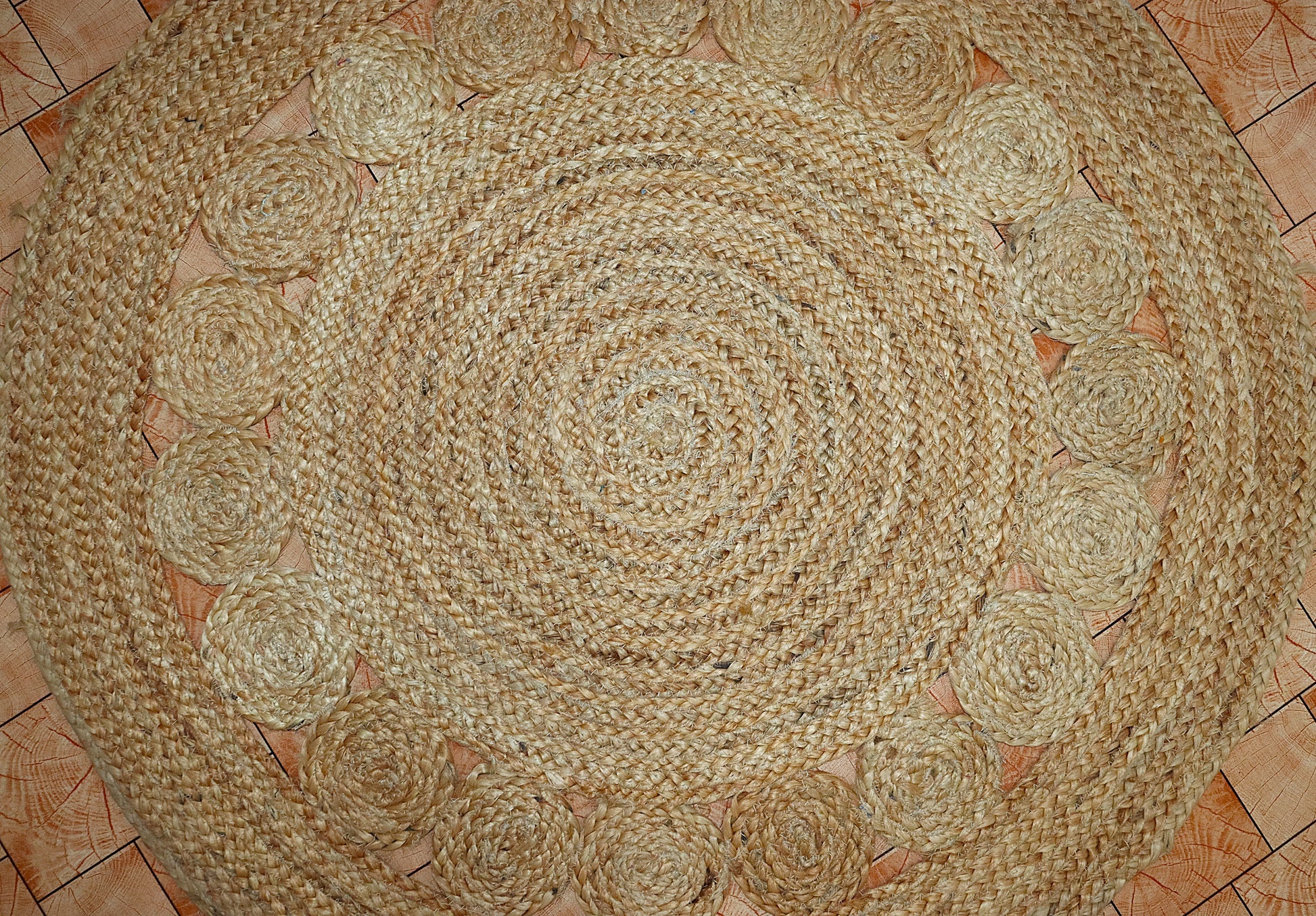 Round braided rug on a tiled floor