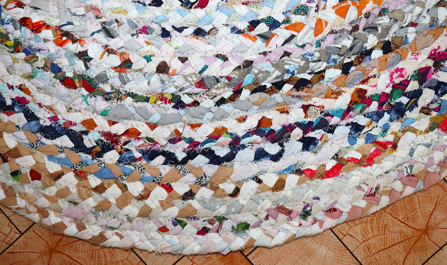 Multicolored braided rug on a wooden floor