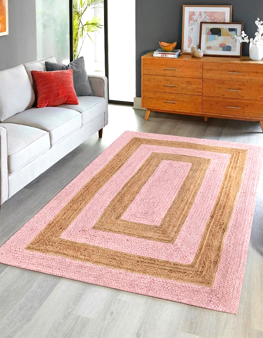 Natural Jute Area Rug pink and tan with geometric pattern in living room on hardwood floor