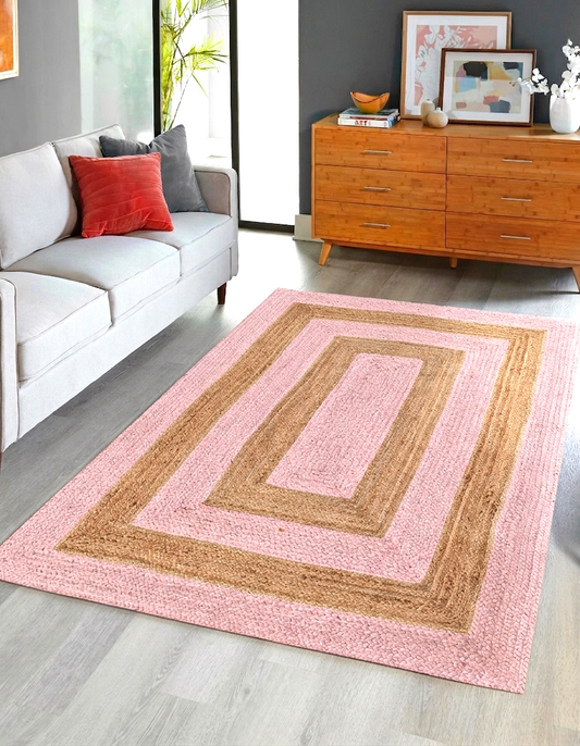 Natural Jute Area Rug pink and tan with geometric pattern in living room on hardwood floor