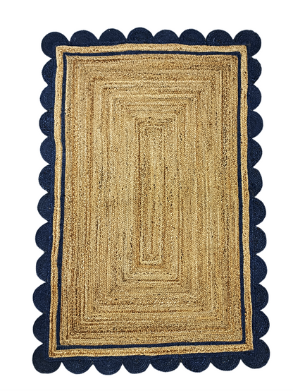 Rectangular jute rug with navy border on a white background