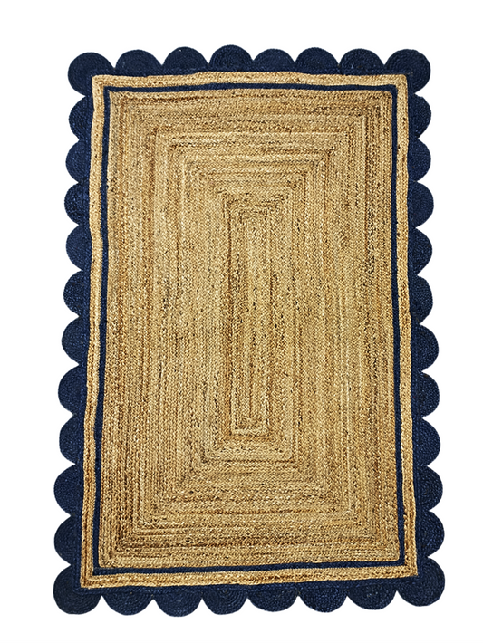 Rectangular jute rug with navy border on a white background