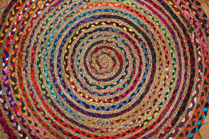 Vibrant Natural Jute Area Rug with colorful braided patterns, perfect for adding texture to any indoor space.