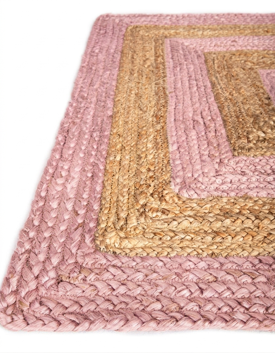Natural Jute Area Rug in tan and pink braided Floor Carpet rug, close-up of woven texture