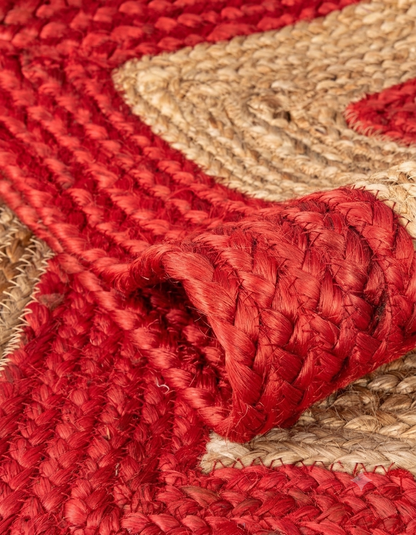 Natural Jute Area Rug red and natural braided jute floor rug close-up with woven texture