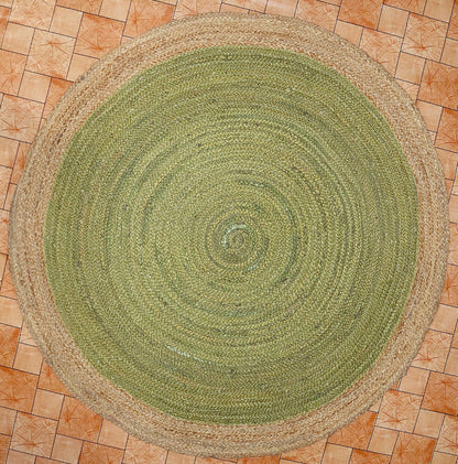 Round green braided rug on a tiled floor