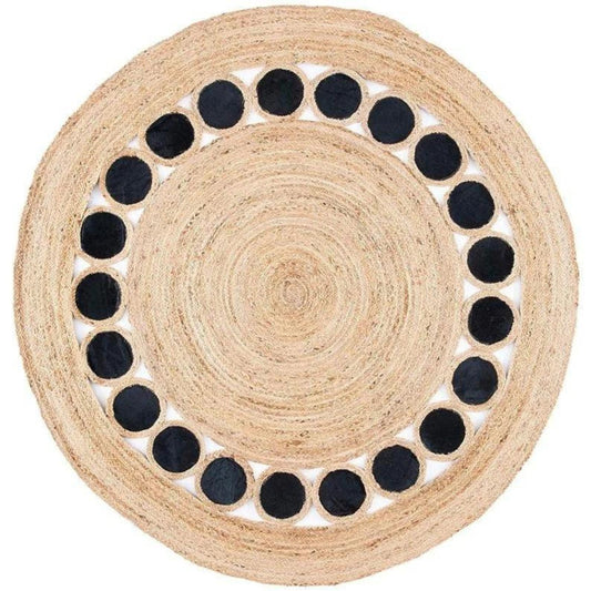 Round woven mat with black circular patterns on a white background