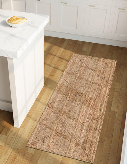 Beige area rug on a wooden floor in a kitchen setting