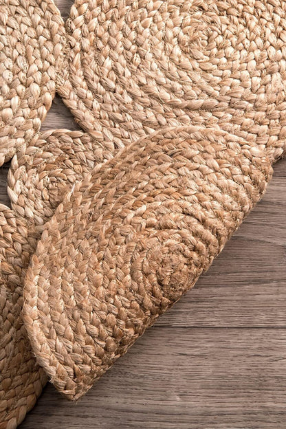 Close-up of a woven jute rug on a wooden floor