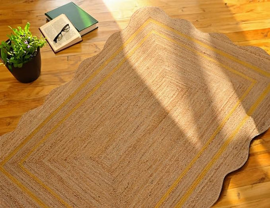 Beige area rug with yellow stripes on a wooden floor