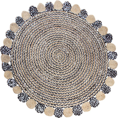 Round woven rug with pom-pom trim on a white background