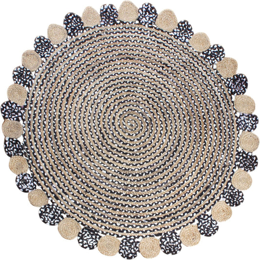 Round woven rug with pom-pom trim on a white background