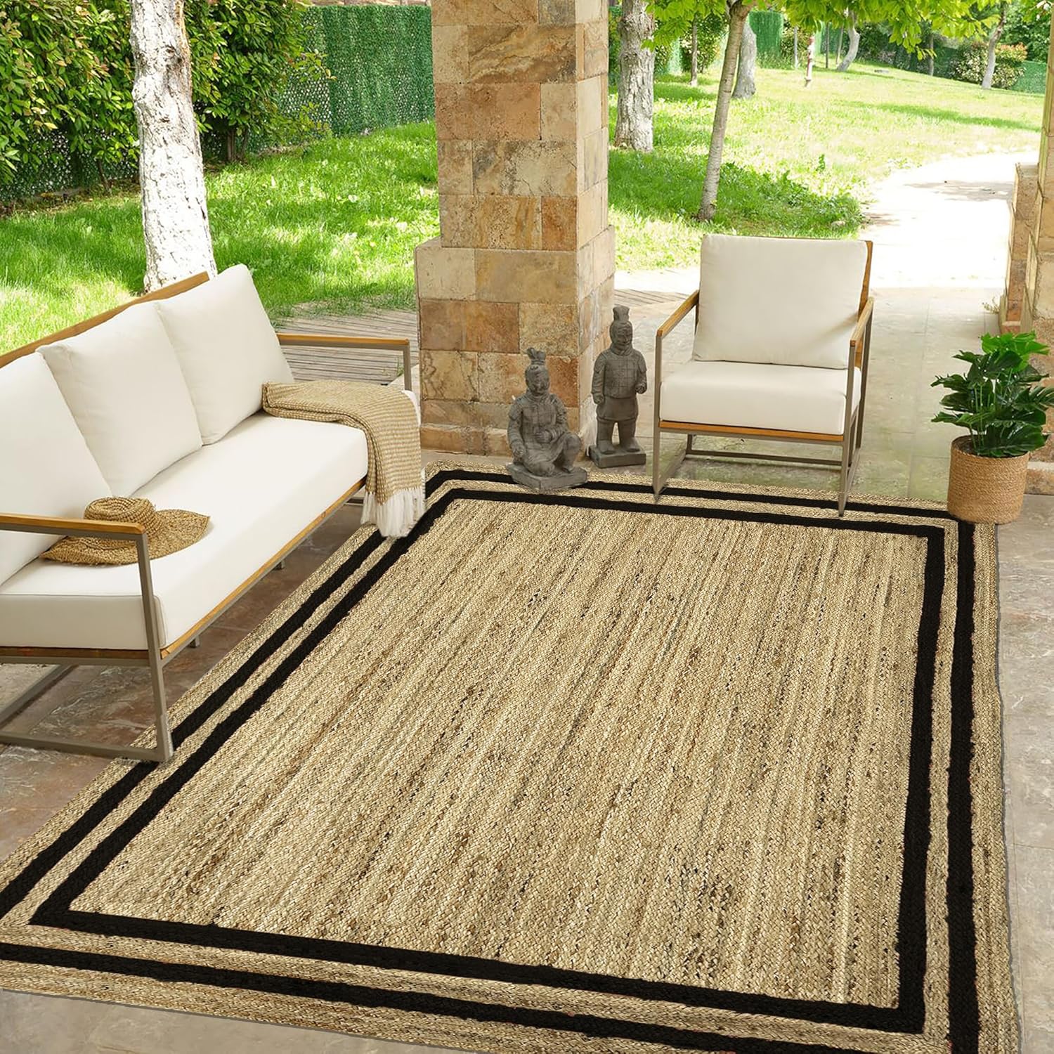 Natural Jute Area Rug with black border, ideal for outdoor or indoor use in living spaces or entryways.