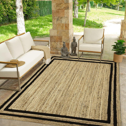 Natural Jute Area Rug with black border, ideal for outdoor or indoor use in living spaces or entryways.