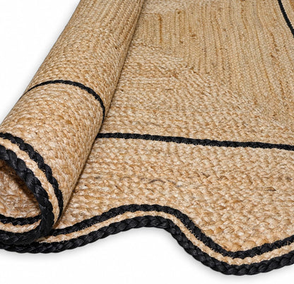 Natural Jute Area Rug with black trim, suitable for living room or entryway as a floor carpet.