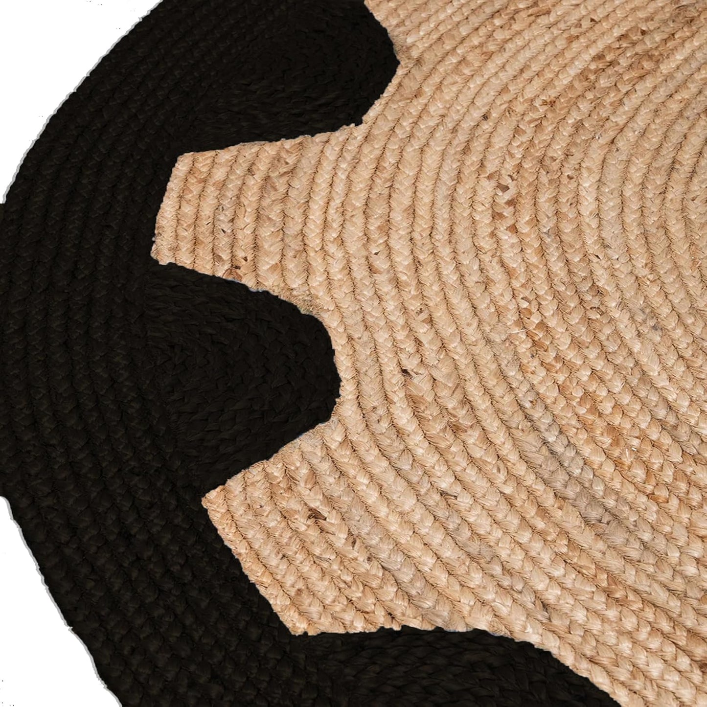 Close-up of a black and beige woven mat with concentric circle pattern