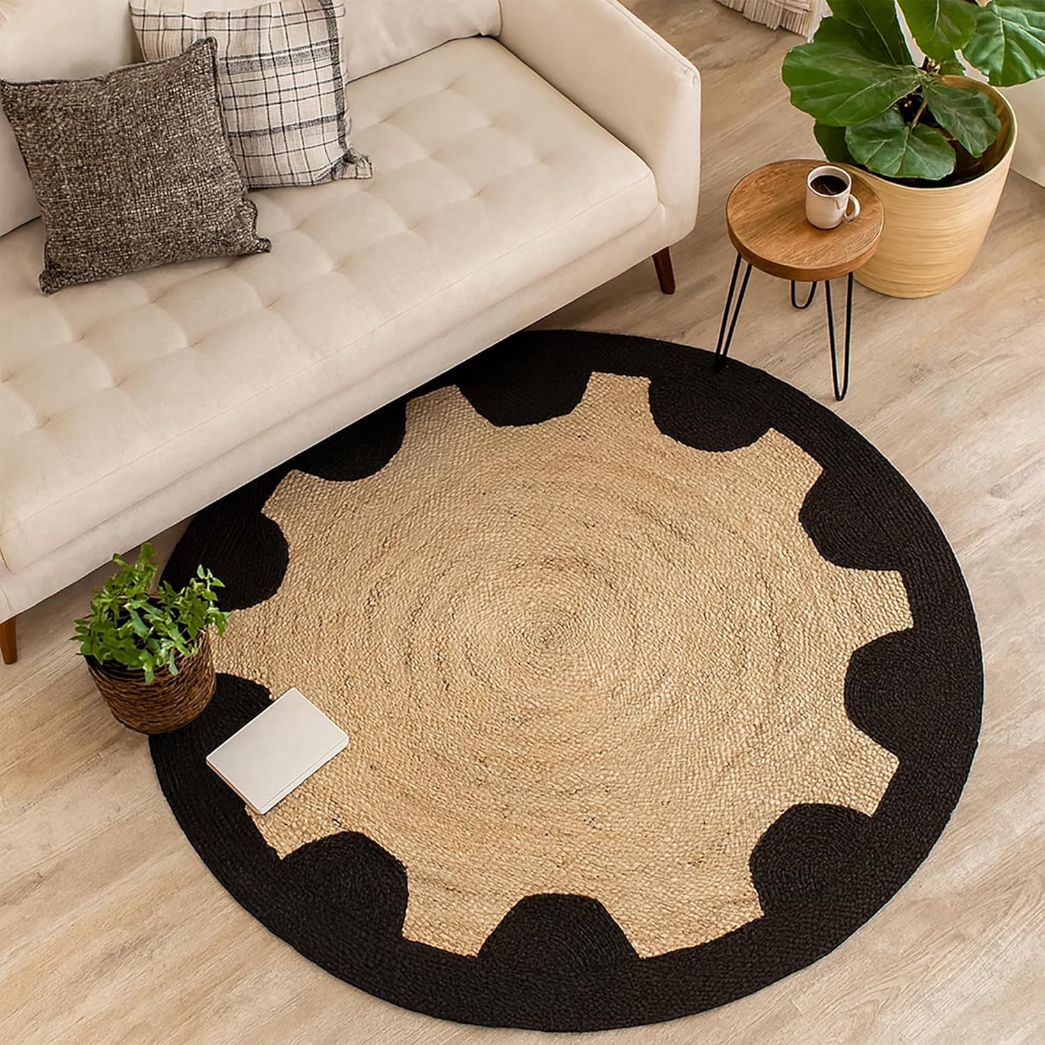 Round beige rug with black border in a living room setting