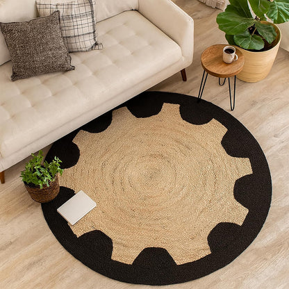 Round beige rug with black border in a living room setting